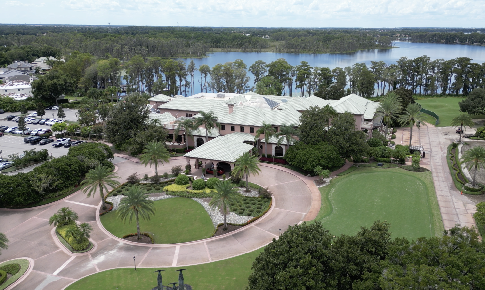 drone shot of amenity center with lake in background